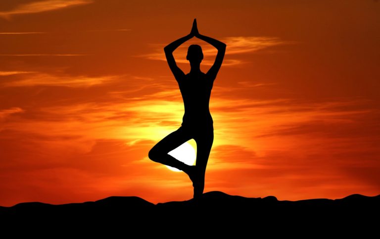 yoga silhouette sunset meditation 768x482